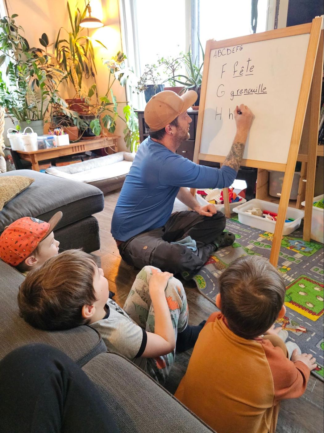 Phil homeschooling the boys at the whiteboard